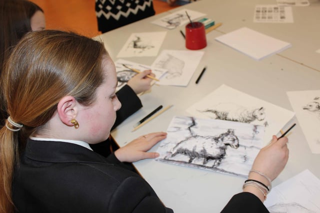 Maisie from 10SMA showing off her wonderful talents and helping the prospective pupils with their art