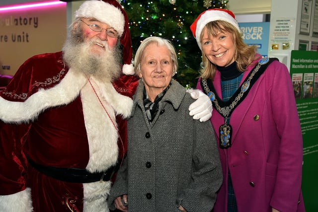 Portadown lady, Ethel Gillespie poses happily with Santa and Lord Mayor of ABC Council, Alderman Margaret Tinsley during the Mayor's visit to Craigavon Area Hospital.