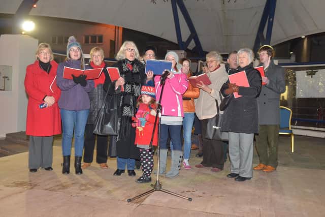Larne Concert Choir singing out at the Larne Christmas lights switch-on in 2013.