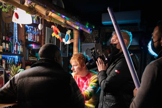 Carl Quinn shooting with Ed Sheeran