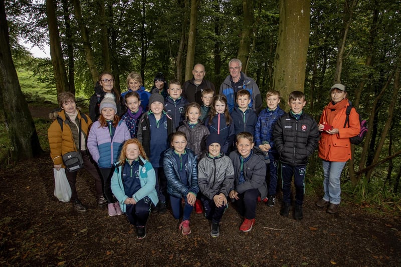 Staff and pupils from St Canice’s Primary School Feeny, with staff and students from Ulster University School of Education, facilitator Aubrey Beggs, President of Coleraine Rotary Michael Magee and Loretto Blackwood from Mountsandel Discovery and Heritage Group after a foraging tour of the woods.