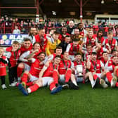 Celebration time for Larne FC as the team receives the Gibson Cup at Inver Park. Photo: Andrew McCarroll / Pacemaker