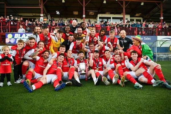 Celebration time for Larne FC as the team receives the Gibson Cup at Inver Park. Photo: Andrew McCarroll / Pacemaker