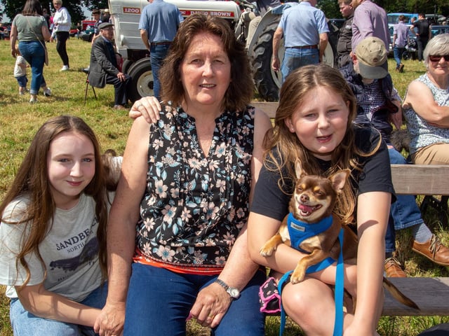 Waiting for the dog show to begin at the Drumcree Parish Garden Fete are from left, Leah Platt, Daphne Lynas, Lexi Platt and their dog, Benji. PT23-231.