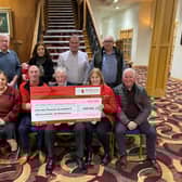 Representatives of the Livingstone Tractor Run and Air Ambulance NI: Back row l/r: David Bloomer, Una and Anna Lavery, Cedric Livingstone, Harper Doupe  Front row: Joanne Hale, Tom Hadden, Ben Sergeant, Liz and James Carragher