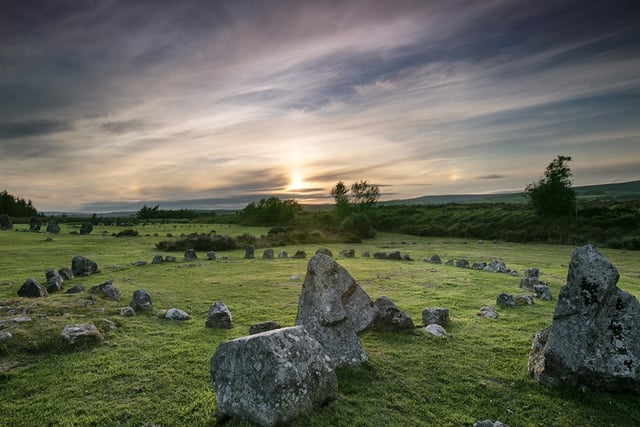 Nestled among the heather west of Cookstown, Beaghmore (‘big place of birch trees’) was once an area of dense woodland before being cleared by Neolithic farmers. Only discovered by peat cutters in the 1930s, deposits of flint tools and hearths have been dated to at least 2900-2600 BC.
If you look closely at some stones, what may appear at first as ancient chisel marks bear a striking resemblance to the oldest known form of Celtic writing, Ogham; a sacred form of writing that was supposedly used for magic and divination.
Some archaeologists believe that the circles were constructed in relation to the midsummer sunrise, or to record the movements of the sun and moon acting as markers in a calendar to identify certain solar or lunar phases.