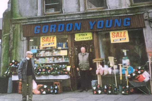 Gordon Young's shop at the Rainey Street entrance to the carpark was one of a number of small shops in Magherafelt which sold just about everything. They have all now disappeared from the high street. Gordon, who was also a part time fire fighter, is pictured in the doorway of his premises.