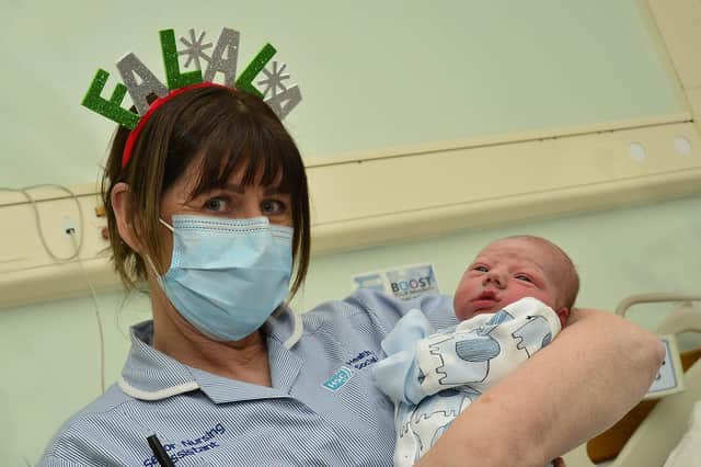 Gerald Og Clarke born at 3.58am weighing 6lb 13oz on Christmas Day, pictured with Ann Doherty at the Royal Victoria Hospital in Belfast.
Picture by: Arthur Allison/Pacemaker Press.