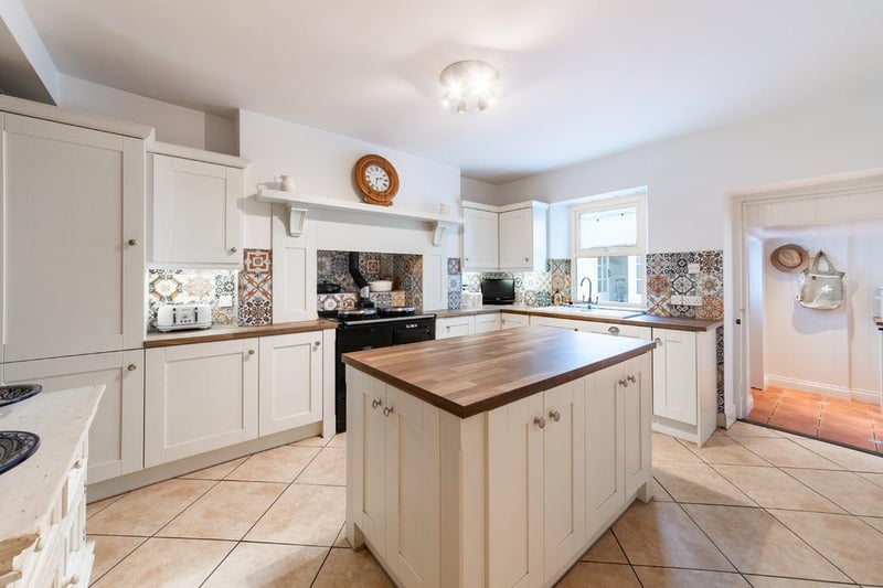 Bright and spacious kitchen with Aga stove.