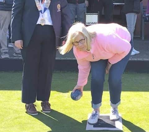 Carol Millar, mother of the 2025 Lurgan Club President, Teri Millar delivering the traditional first bowl of the season on Opening Day