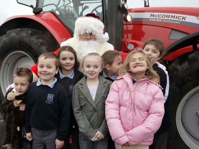 Pictured along with Santa Claus, who arrived in a different mode of transport at Lislagan PS in 2008, are pupils who were only too happy to smile for our cameraman.