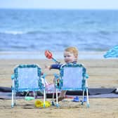 Enjoying a nice day at Helen’s Bay beach. Picture: Arthur Allison / Pacemaker Press.