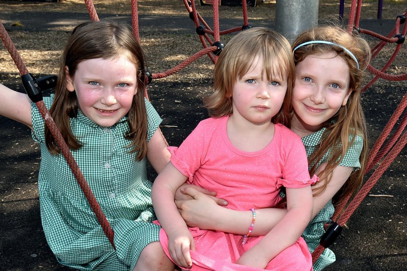 The hot weather made playing in the Portadown People's Park playground even more enjoyable for the Phillips sisters from left, Lily (6), Anna (2) and Ella (9). PT22-251.