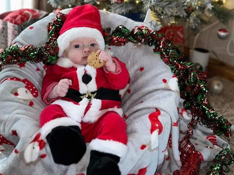 A full Santa outfit for this little one.