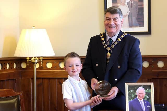 Lewis showing his award to the Mayor, Alderman Noel Williams.