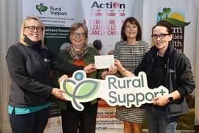 Rural Support receiving a cheque from Garryduff Presbyterian PW
