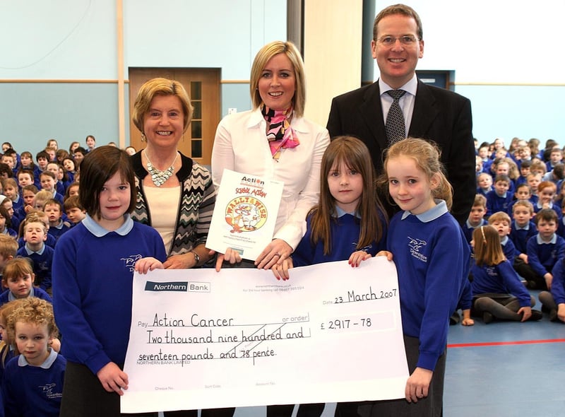In 2007 Action Cancer's Lucy Latewood received a cheque of £2917 from Margaret McClean Charity Coordinator Downshire Primary, Principal John Knaggs and Pupils Georgia Beaton, Rachel Arthur and Amy Letman.