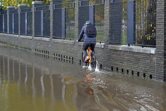 A cyclist tries to negotiate the flood waters in Park Road on Tuesday.PT44-252.