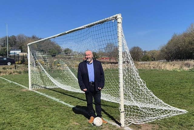 Councillor Brian Higginson has announced the reopening of the Carryduff football pitch. Pic credit: LDRS