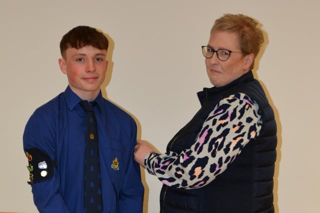 Matthew Rea with his mother Karen presenting him with his President's badge.