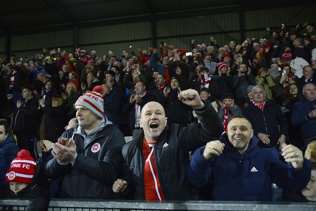 Fans celebrate after Larne's big win on Friday night. Picture: Arthur Allison/Pacemaker Press