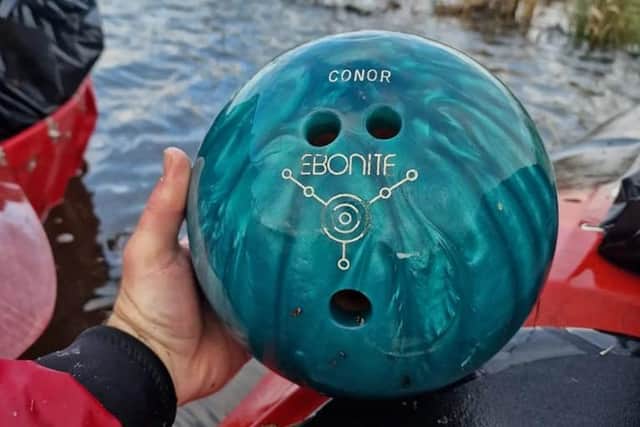 A bowling ball, with the name Conor emblazoned on it, was recovered from the River Bann near Portadown this month (January 2023) by anti-litter canoeist John Medlow and his team of volunteers. Jon said the bowling ball was floating in the river.