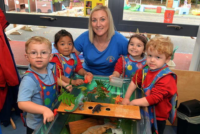 Nursery assistant Ann Smyth pictured with some of the pupils ov Millington Nursery School enjoying water play including from left, Joseph, Yolonda, Zosia and Eddie. PT41-343.