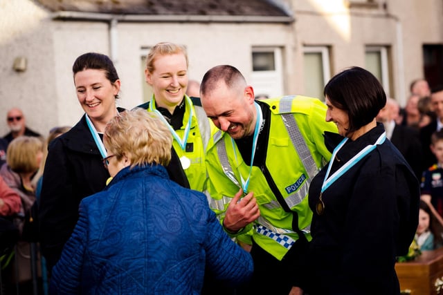 Councillor Vera McWilliams awarded the 'Wheeler Peelers' their medal for third place.