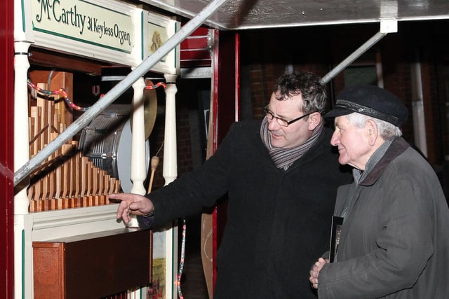 Gilbert Armour explains how it all works to John McKendry from Whitehead at the 2011 fair.