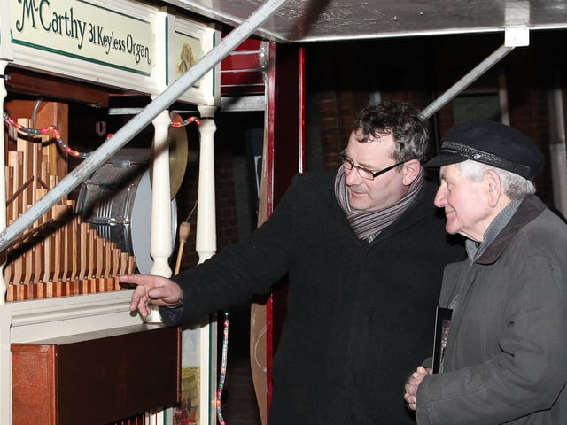 Gilbert Armour explains how it all works to John McKendry from Whitehead at the 2011 fair.
