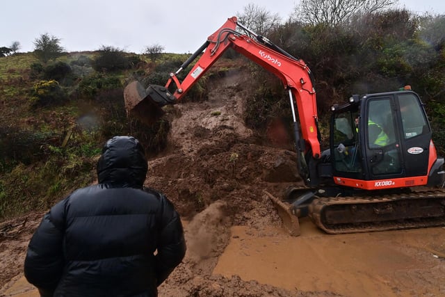 Work continues to clear the road after the landslide near Glenarm.