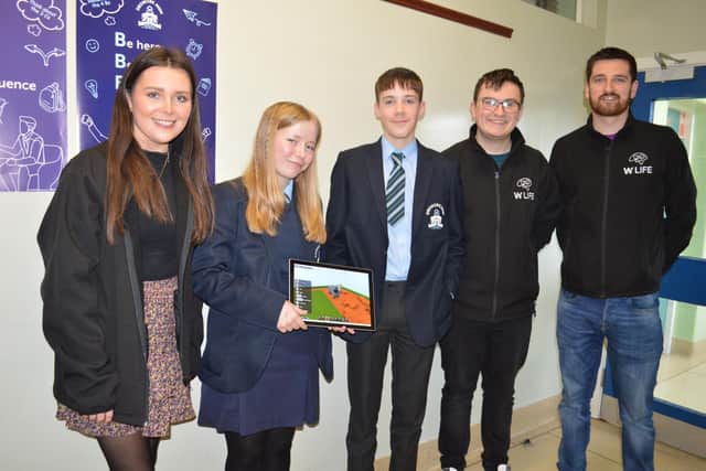 At the Dromore High IT Day are, rom left, Laura McCaig Stranmillis student teacher on placement with W5, Jessica Chambers, Reece Robinson, Stranmillis student teacher on placement, Finn Harrison and Conor McKay W5. Pic credit: Dromore High School