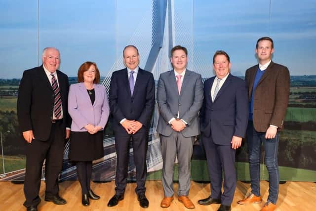 Taoiseach, Micheál Martin with Minister for Housing, Heritage and Local Government, Darragh O’Brien; Richie Walsh and Dónal Ó Murchadha of Waterford City and County Council and Patricia Brennan and John McVeigh of Mid and East Antrim Borough Council.