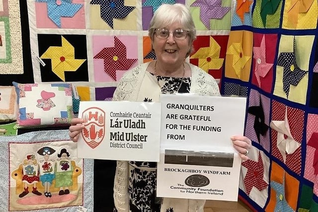 Martha Brown, committee member highlighting funders that have helped the group.
