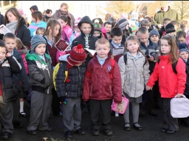 Pupils of Hollybank Primary School await the arrival of Santa to turn on the Christmas tree lights in Monkstown in 2010.