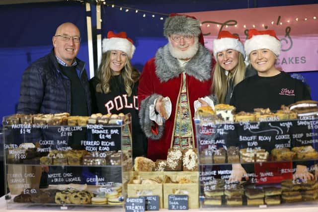 Pictured at the market with Santa are (l-r) Cllr John Laverty BEM, Chairman of the council’s Regeneration & Growth Committee; Ella Brown, Beth Stephenson and Tori McCaughey of Tori’s Coffee, Bakes and Cakes. Pic credit: Stephen Davison