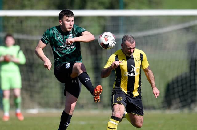 Bridge midfielder Thomas Hardy lift's the ball over Church Street defender Davy Bagnall on Saturday Pictures: Brendan Monaghan