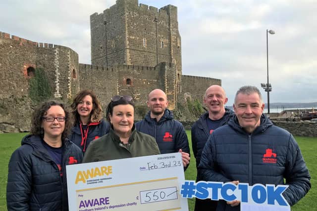 Seapark’s Andy Smyth Race Director, Storming the Castle and members of the committee from Seapark AC, presented a cheque for £550 to Lesley Wright, Community and Events Officer, Aware from the proceeds of last year’s Storming the Castle 10K Road Race in Carrickfergus. Pictured front, from left: Laura Laverty, Seapark AC; Lesley Wright, Aware; Andy Smyth, Seapark AC. Back, from left:  Justine Eagleson, Jamie Stronge, Bobbie Irvine, all Seapark AC.