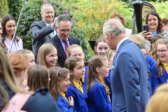 These young pupils enjoy meeting King Charles. Picture: Colm Lenaghan/Pacemaker