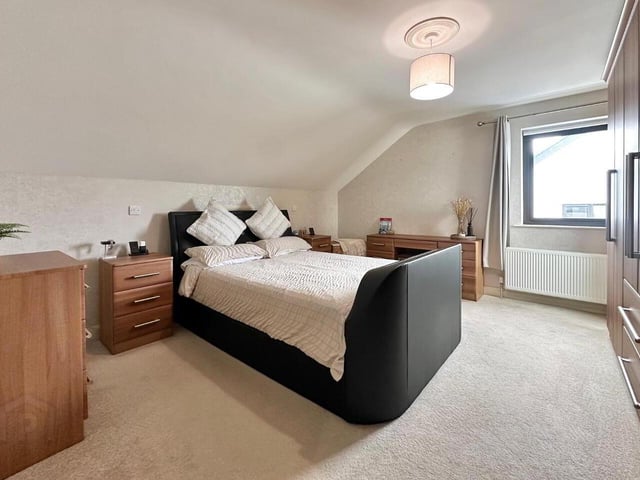 Bedroom with carpet floor, built in bedroom furniture and en-suite.