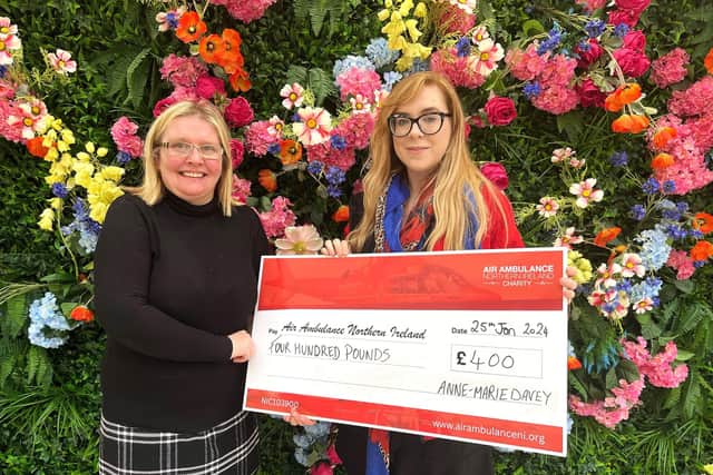 Anne-Marie Davey presenting a cheque to Katrina Hughes, Area Fundraising Manager for Air Ambulance NI. Credit: Submitted