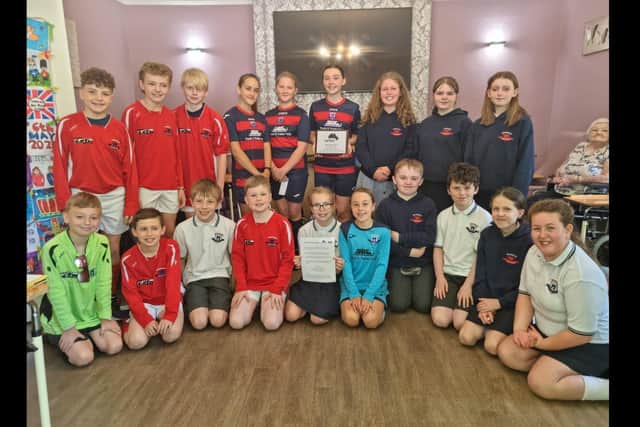 Pupils from Moorfields Primary School took part in the Book Buddies project with residents of Galgorm Care Home in Ballymena.  Photo: Mid and East Antrim Agewell Partnership