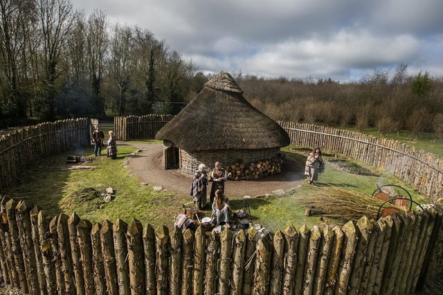 To the west of Armagh city lies one of the great royal sites of pre-Christian Ireland, as well as the headquarters of the Ulaid kingdom that covered much of Ulster.
The ancient ‘Emain Macha’ of Irish history consists of a large earthwork on top of a drumlin and is thought to have been the site of a pagan sanctuary. In early Irish mythological tales, Emain also served as the base for the Red Branch Knights, the mythological warriors of Ulster.
Once you visit, your guide will carefully explain how and why the sprawling ceremonial capital was built, as you immerse yourself in Iron Age life, and hear stories of past triumphs, weaving, cooking, or preparing weapons for battle.