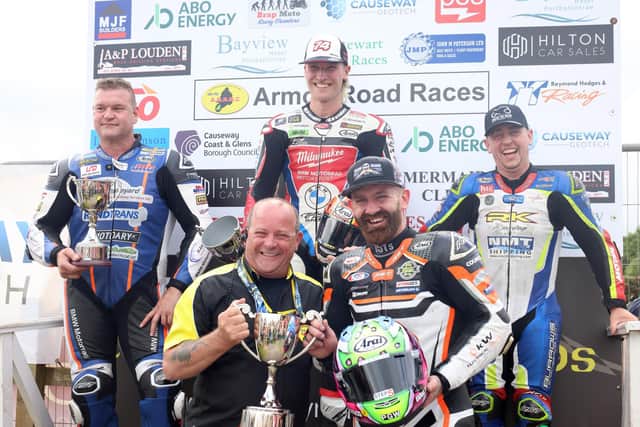 Last year’s Man of the Meeting at Armoy Road Races, Jamie Coward is pictured receiving his trophy from AMRRC Assistant Chairman / Director, Stanley Stewart. Also included in the photo from left, is Phillip Crowe, Davey Todd and Dominic Herbertson. Saturday’s racing at the Armoy Road Races is set to be streamed live on the BBC iPlayer for UK audiences and available internationally on the BBC Sport NI website. CREDIT STEPHEN DAVISON