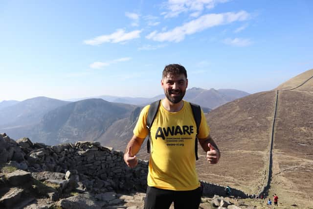 Darran Wallace takes a break from one of the charity hikes. CREDIT DARRAN WALLACE