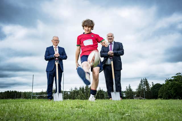 George Campbell 'kicks off' the new school project at Coleraine Grammar School as Dr David Carruther and Willam Oliver look on. Photo submitted by Coleraine Grammar School.