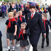 Brenda Johnston with St Columba's Penguins during the Commonwealth Day Youth Parade in 2015. Brenda is giving some young boys and girls a helping hand at the parade in Portadown. INPT24-232.