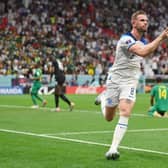 Jordan Henderson of England celebrates after scoring the team's first goal against Senegal at the Al Bayt Stadium. (Photo by Dan Mullan/Getty Images)