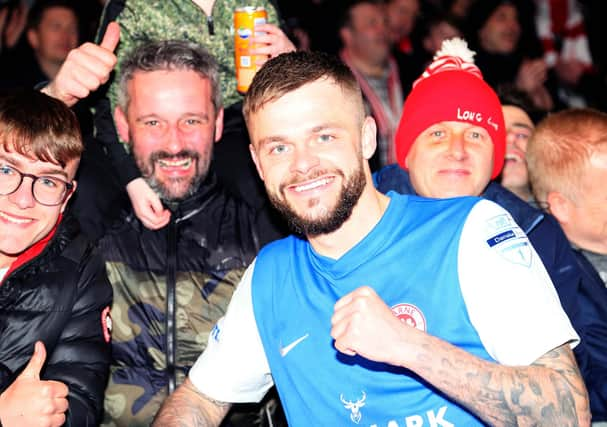 Larne's Andy Ryan celebrates with club supporters.  Photo by David Maginnis/Pacemaker Press