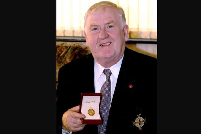 Portadown's John Brown with his Long Service Medal presented by the Irish Football Association.